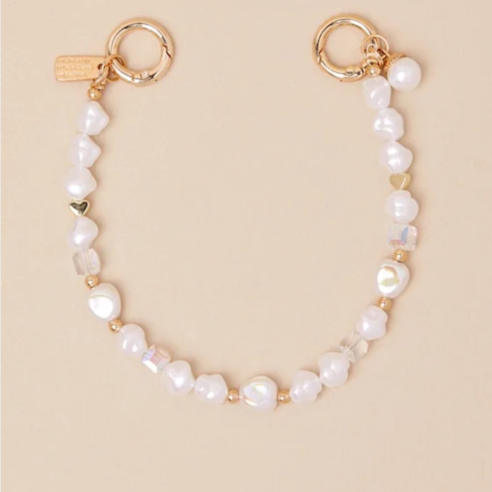 Lulu's White and Gold charm
